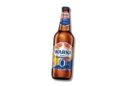 Szklanka bezalkoholowego napoju piwnego Radler o smaku grejpfruta i pomarańczy